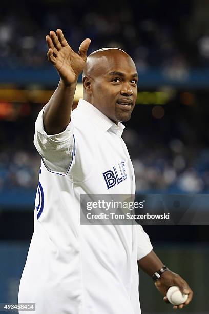 Toronto Blue Jays former player Carlos Delgado throws out the ceremonial first pitch prior to game four of the American League Championship Series...