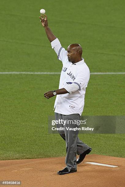 Toronto Blue Jays former player Carlos Delgado throws out the ceremonial first pitch prior to game four of the American League Championship Series...