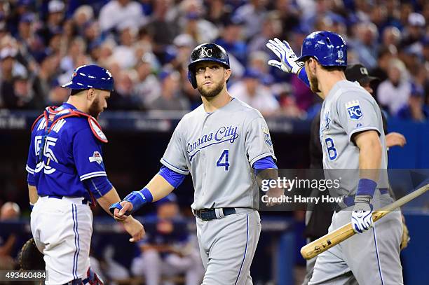 Alex Gordon of the Kansas City Royals reacts after scoring a run in the seventh inning against the Toronto Blue Jays during game four of the American...