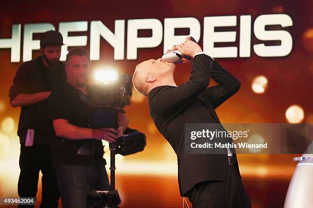 Stefan Raab kisses the trophy after receiving the 'Ehrenpreis' at the 19th Annual German Comedy Awards at Coloneum on October 20, 2015 in Cologne,...