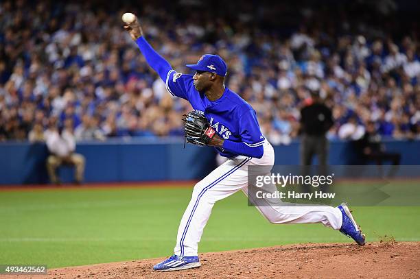 LaTroy Hawkins of the Toronto Blue Jays throws a pitch in the seventh inning against the Kansas City Royals during game four of the American League...