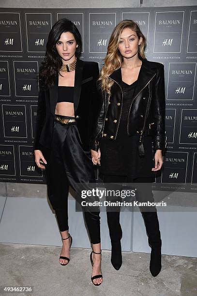 Models Kendall Jenner and Gigi Hadid attend the BALMAIN X H&M Collection Launch at 23 Wall Street on October 20, 2015 in New York City.