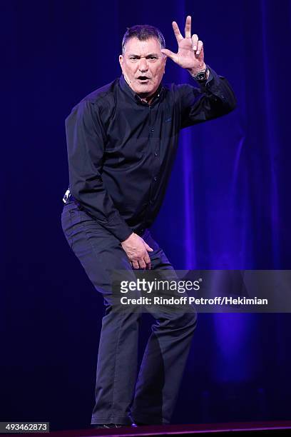 Humorist Jean-Marie Bigard performs in his One Man Show 'Bigard Fete Ses 60 Ans' at Le Grand Rex on May 23, 2014 in Paris, France.