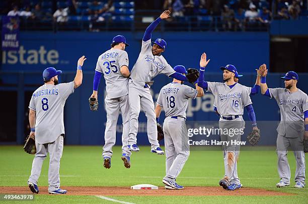Eric Hosmer of the Kansas City Royals and Jarrod Dyson of the Kansas City Royals celebrate defeating the Toronto Blue Jays 14-2 in game four of the...