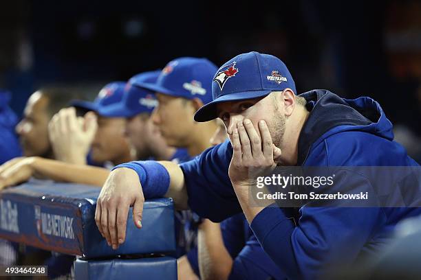 Justin Smoak of the Toronto Blue Jays looks on from the dugout in the ninth inning against the Kansas City Royals during game four of the American...