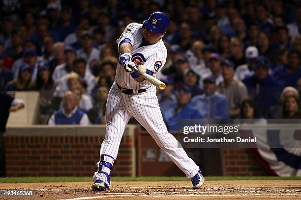 Kyle Schwarber of the Chicago Cubs hits a solo home run in the first inning against Jacob deGrom of the New York Mets during game three of the 2015...