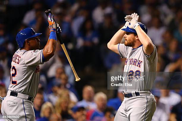 Daniel Murphy of the New York Mets celebrates with Yoenis Cespedes after hitting a solo home run in the third inning against Kyle Hendricks of the...
