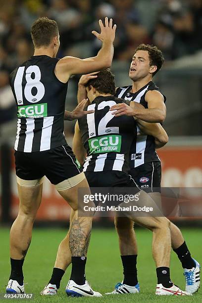 Jarryd Blair of the Magpies celebrates a goal with Jesse White and Luke Ball of the Magpies during the round 10 AFL match between the Collingwood...