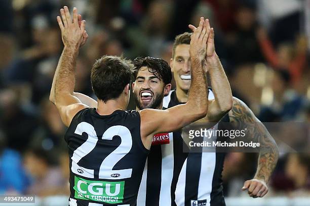 Steele Sidebottom of the Magpies celebrates a goal with Alex Fasolo during the round 10 AFL match between the Collingwood Magpies and West Coast...