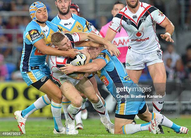 Sam Tomkins of the Warriors is tackled during the round 11 NRL match between the Gold Coast Titans and the New Zealand Warriors at Cbus Super Stadium...