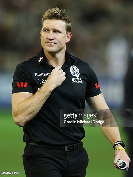 Magpies coach Nathan Buckley looks up at the scoreboard during the round 10 AFL match between the Collingwood Magpies and West Coast Eagles at...