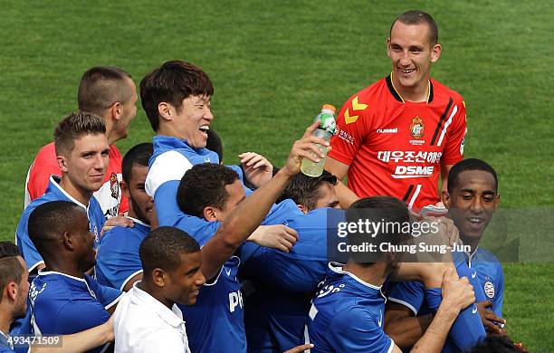 Eindhoven players carry their team mate Park Ji-Sung after his farewell match between PSV Eindhoven and Gyeongnam FC at Changwon Stadium on May 24,...