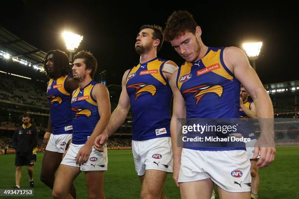 Nic Naitanui, Matt Rosa, Eric Mackenzie and Luke Shuey of the Eagles walk offloads the ball in a tackle after losing during the round 10 AFL match...