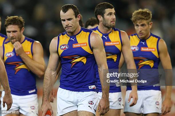 Shannon Hurn of the Eagles walks offloads the ball in a tackle after losing during the round 10 AFL match between the Collingwood Magpies and West...