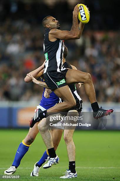 Heritier Lumumba of the Magpies marks the ball during the round 10 AFL match between the Collingwood Magpies and West Coast Eagles at Melbourne...