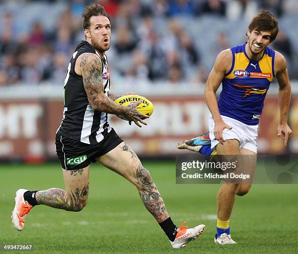 Dane Swan of the Magpies runs with the ball during the round 10 AFL match between the Collingwood Magpies and West Coast Eagles at Melbourne Cricket...