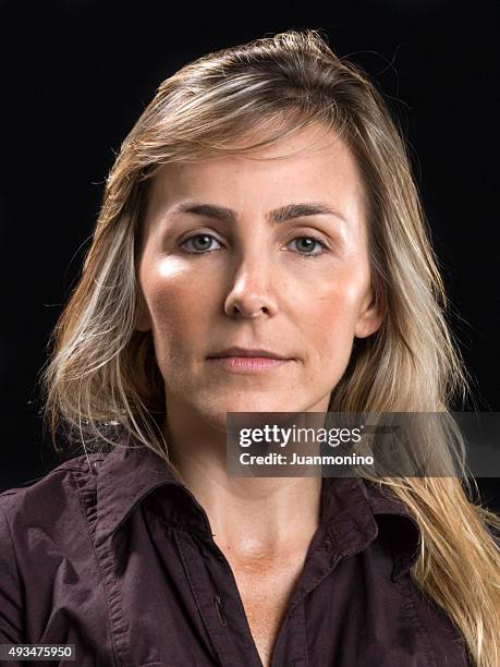 beautiful at her forties (no make up) - blonde hair black background stock pictures, royalty-free photos & images
