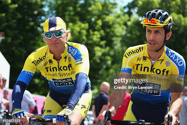 Tinkoff-Saxo team owner Oleg Tinkoff and Tinkoff-Saxo CEO Stefano Feltrin ride ahead of the fourteenth stage of the 2014 Giro d'Italia, a 164km high...