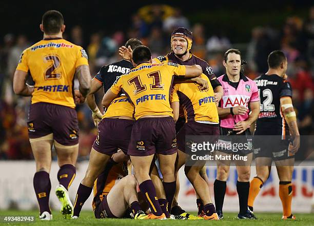 Todd Lowrie of the Broncos celebrates with team mates after victory in the round 11 NRL match between the Wests Tigers and the Brisbane Broncos at...