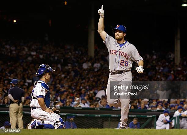 Daniel Murphy of the New York Mets celebrates after hitting a solo home run in the third inning against Kyle Hendricks of the Chicago Cubs during...