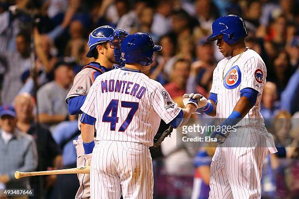 Jorge Soler of the Chicago Cubs celebrates with Miguel Montero after hitting a solo home run in the fourth inning against Jacob deGrom of the New...