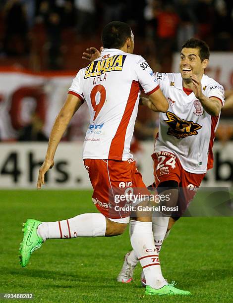 Ramon Abila of Huracan celebrates with Ezequiel Miralles after scoring the opening goal during a match between Huracan and Defensor Sporting as part...