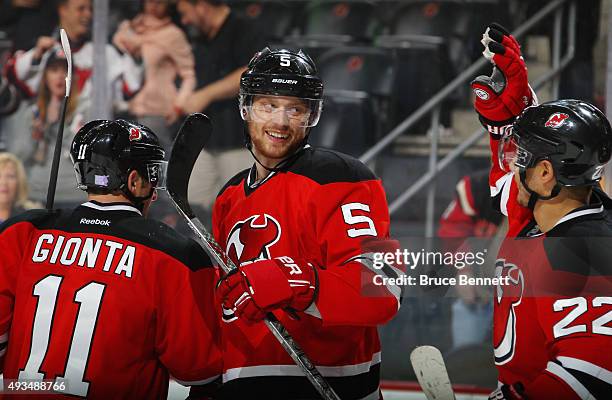 Adam Larsson of the New Jersey Devils celebrates his game winning goal at 43 seconds of overtime against the Arizona Coyotes at the Prudential Center...