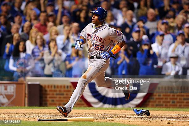 Yoenis Cespedes of the New York Mets scores a run off of a wild pitch thrown by Trevor Cahill of the Chicago Cubs in the sixth inning during game...