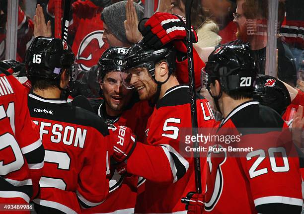 Adam Larsson of the New Jersey Devils celebrates his game winning goal at 43 seconds of overtime against the Arizona Coyotes at the Prudential Center...