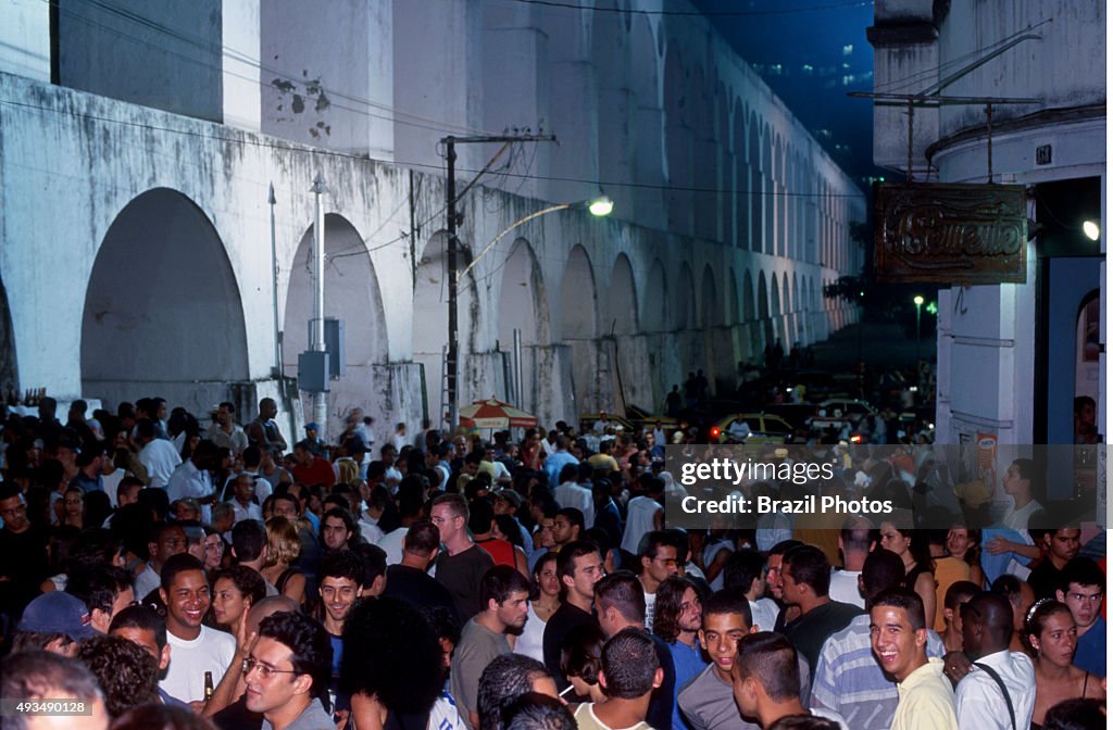 Young and multi-ethnic people enjoy nightlife at Lapa...