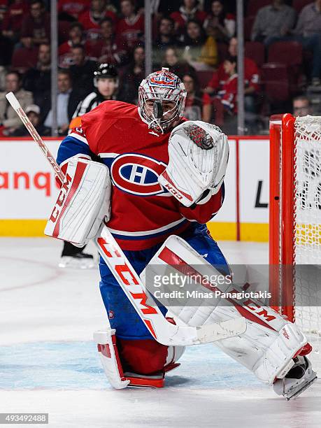 Goaltender Carey Price of the Montreal Canadiens comes face to face with the puck during the NHL game against the St. Louis Blues at the Bell Centre...