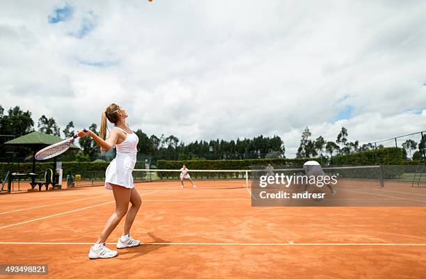 people playing tennis - mixed doubles stockfoto's en -beelden