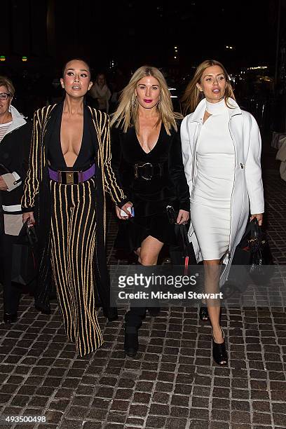 Princess Ezurin Khyra, Hofit Golan and Victoria Bonya are seen outside of the BALMAIN X H&M Collection launch event at 23 Wall Street on October 20,...