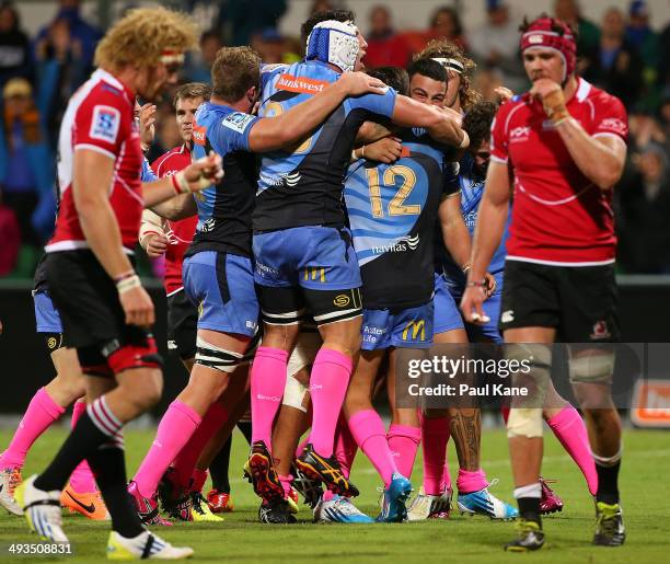 Chris Tuatara-Morrison of the Force celebrates with team mates after scoring a try during the round 15 Super Rugby match between the Western Force...