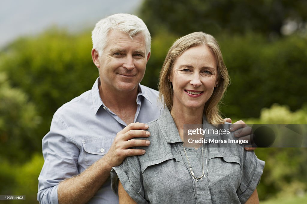 Portrait of mature couple in park