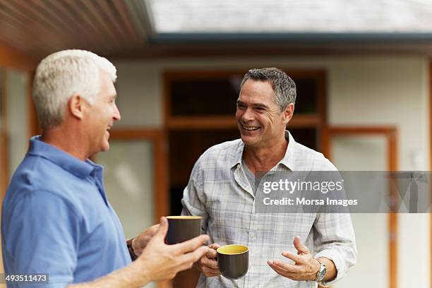 happy friends having coffee - mature men friends stock pictures, royalty-free photos & images