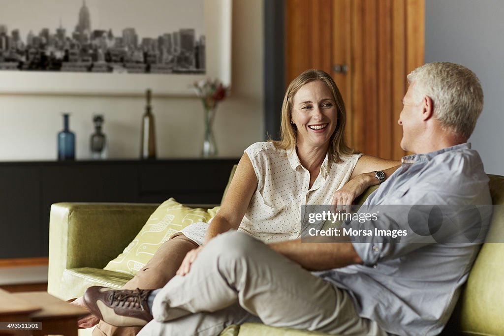 Couple spending leisure time in living room