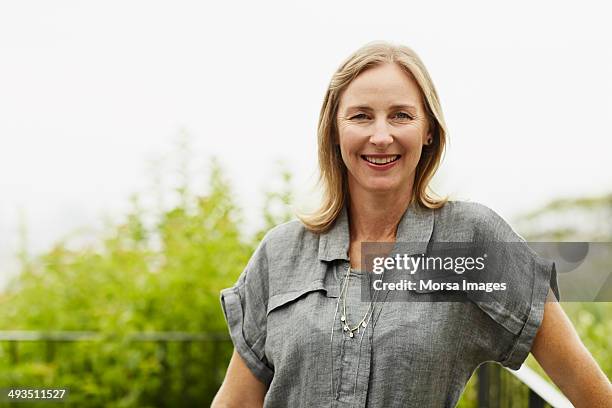 happy mature woman - one woman only 45 49 years stock pictures, royalty-free photos & images