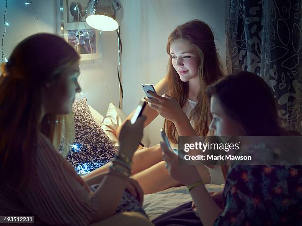 teenage girls - three people bed stock pictures, royalty-free photos & images