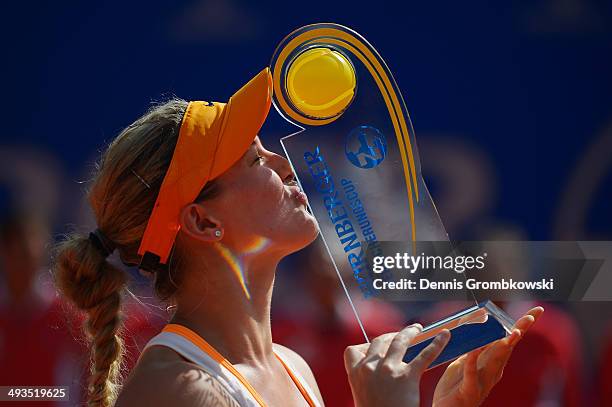 Eugenie Bouchard of Canada kisses the trophy after defeating Karolina Pliskova of Czech Republic during Day 8 of the Nuernberger Versicherungscup on...