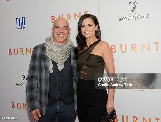 Michael Symon and Katie Lee attend the New York premiere of "BURNT", presented by The Weinstein Company, Sassoregale Wine, Castello Cheese and FIJI...