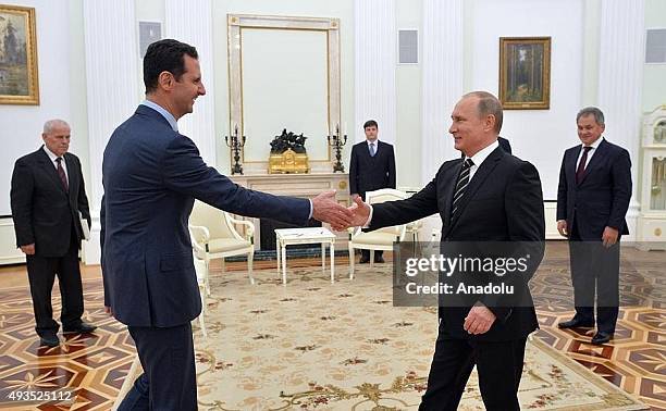 Syrian President Bashar al-Assad meets with Russian President Vladimir Putin at the Kremlin Palace in Moscow, Russia, on October 21, 2015.