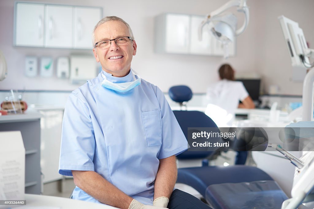 Mature male dentist portrait