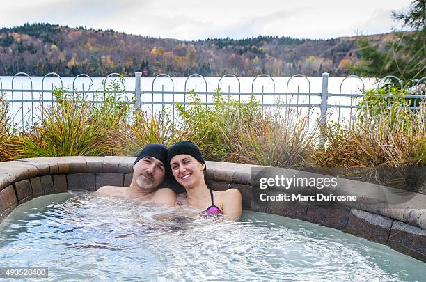 woman and man relaxing in hot tub outside - couple portrait soft stock pictures, royalty-free photos & images