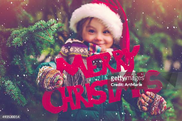 little girl in xmas - small placard stock pictures, royalty-free photos & images