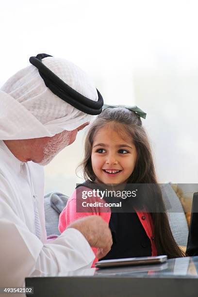 arab father and daughter - saudi grandfather stock pictures, royalty-free photos & images