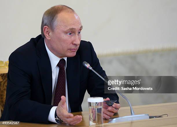 Russian President Vladimir Putin addresses worldwide news agencies and editors at the Saint Petersburg International Economic Forum on May 24, 2014...
