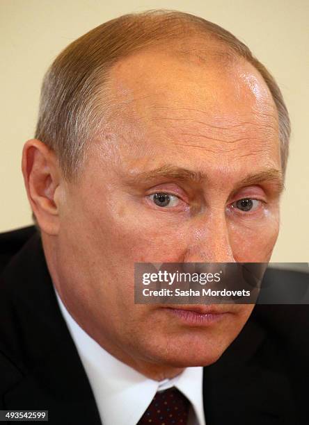 Russian President Vladimir Putin addresses worldwide news agencies and editors at the Saint Petersburg International Economic Forum on May 24, 2014...