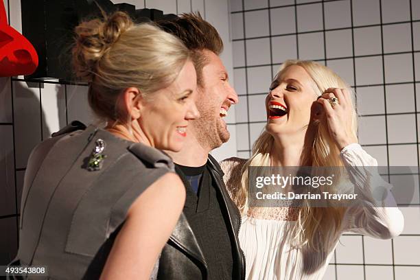 Poppy Delevingne shares a laugh with MRP Foundation ambassador and mentor Henry Holland during the launch of the first Australian MRP store at...