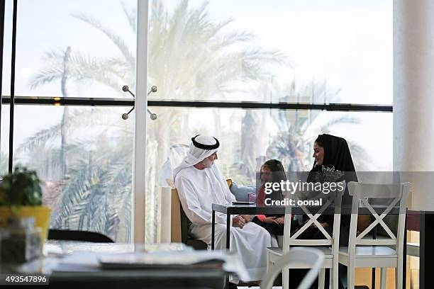 arab family enjoying leisure time together - saudi grandfather stock pictures, royalty-free photos & images